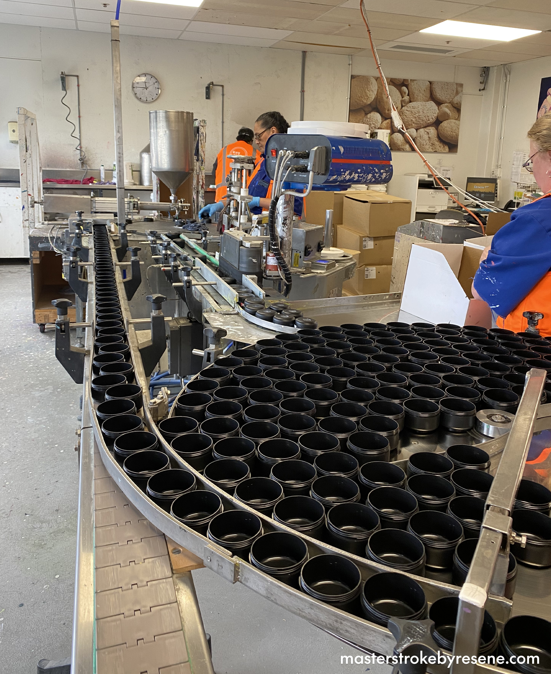 empty testpots on conveyor belt