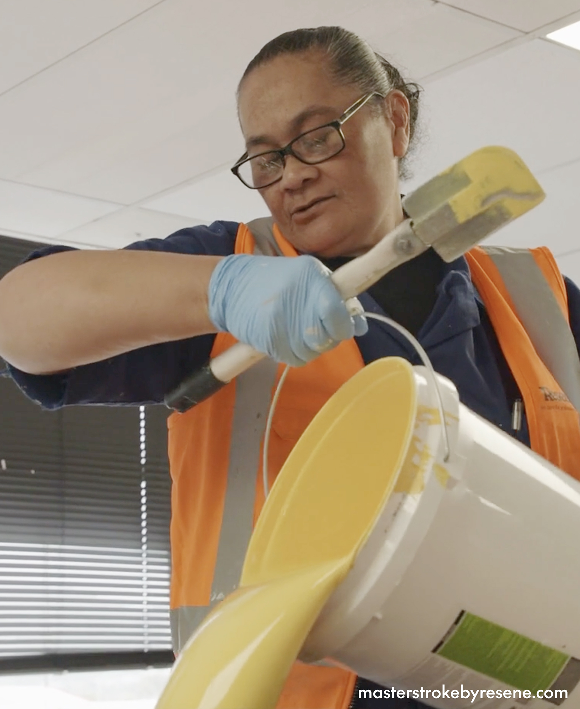 woman pouring paint